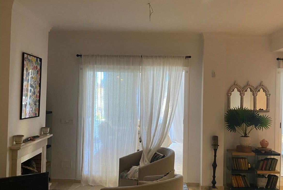 Comfortable seating area in the living room of a duplex apartment in San Roque Club Sotogrande.