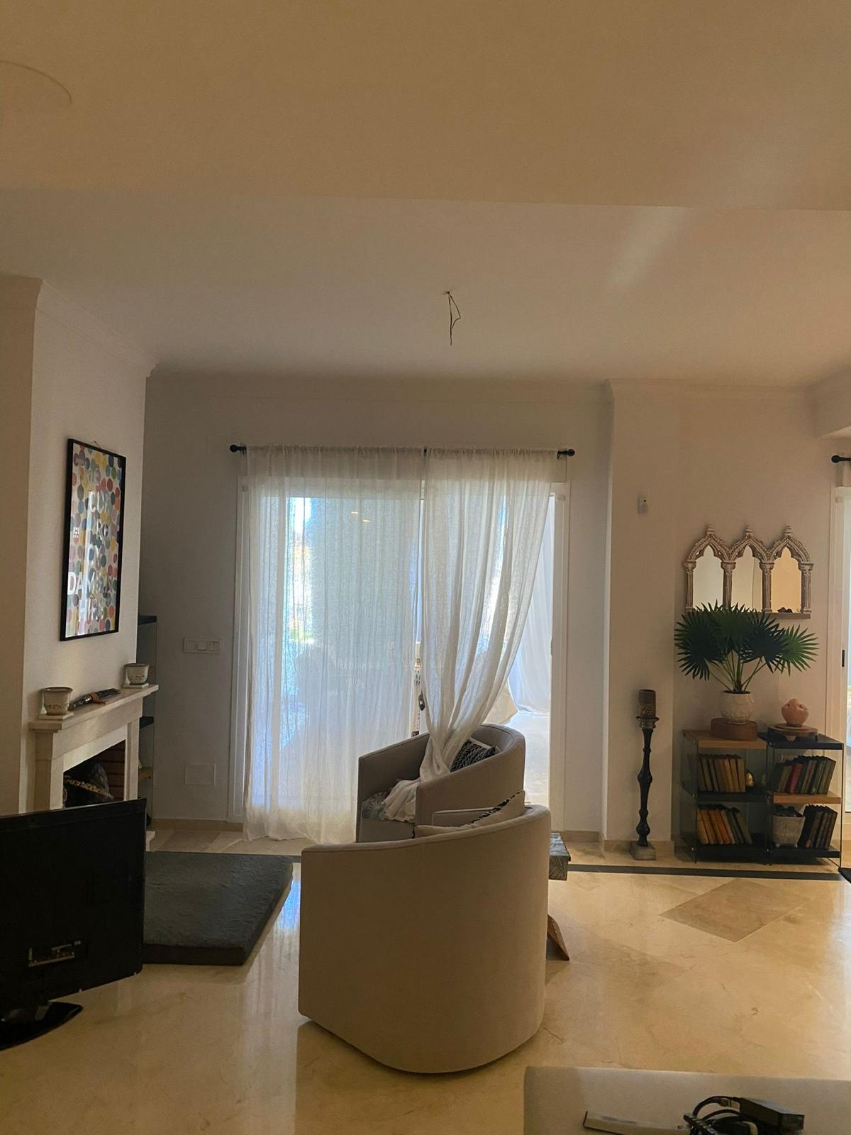 Comfortable seating area in the living room of a duplex apartment in San Roque Club Sotogrande.