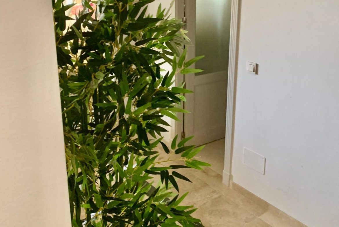 Interior hallway inside a duplex apartment in San Roque Club Sotogrande.