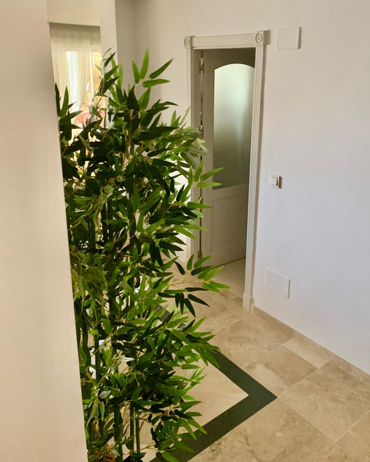 Interior hallway inside a duplex apartment in San Roque Club Sotogrande.