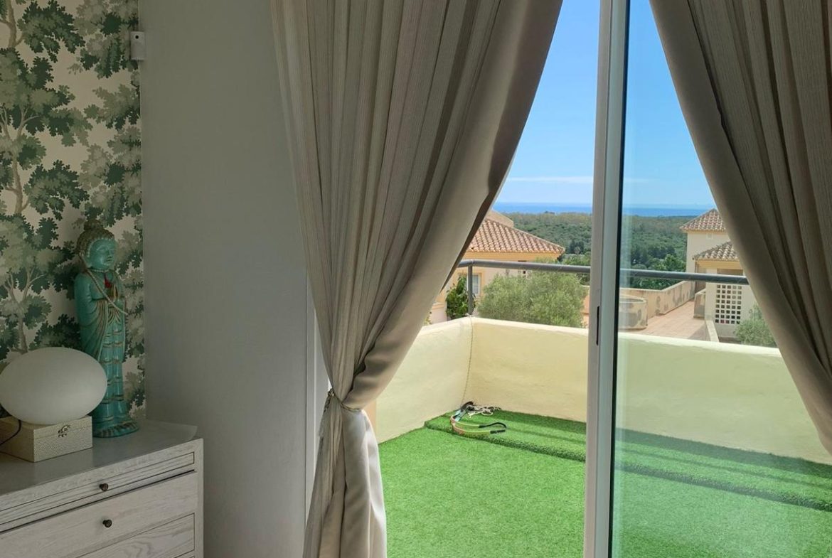 Bright bedroom with terrace and views in a duplex apartment in San Roque Club Sotogrande.