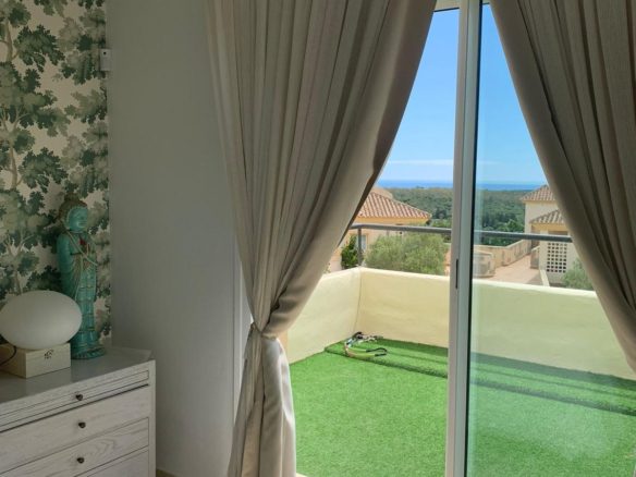 Bright bedroom with terrace and views in a duplex apartment in San Roque Club Sotogrande.