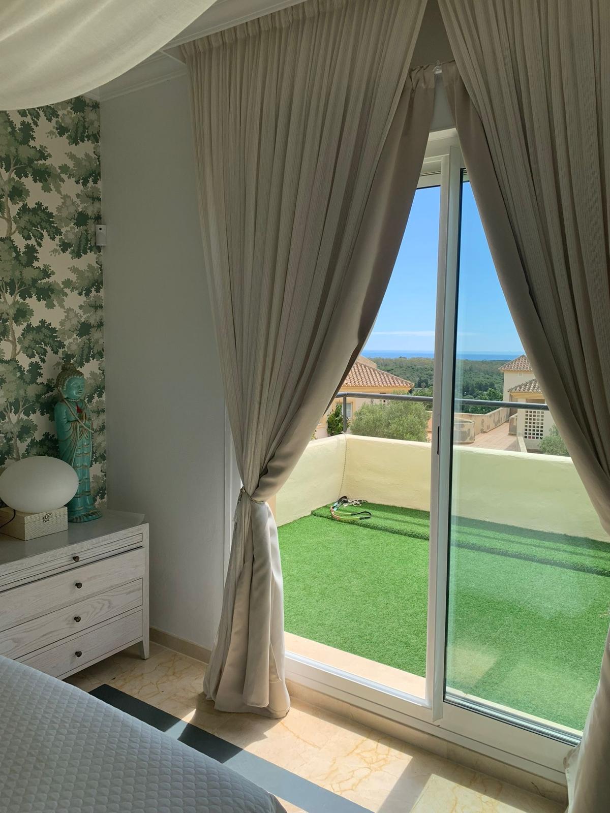 Bright bedroom with terrace and views in a duplex apartment in San Roque Club Sotogrande.