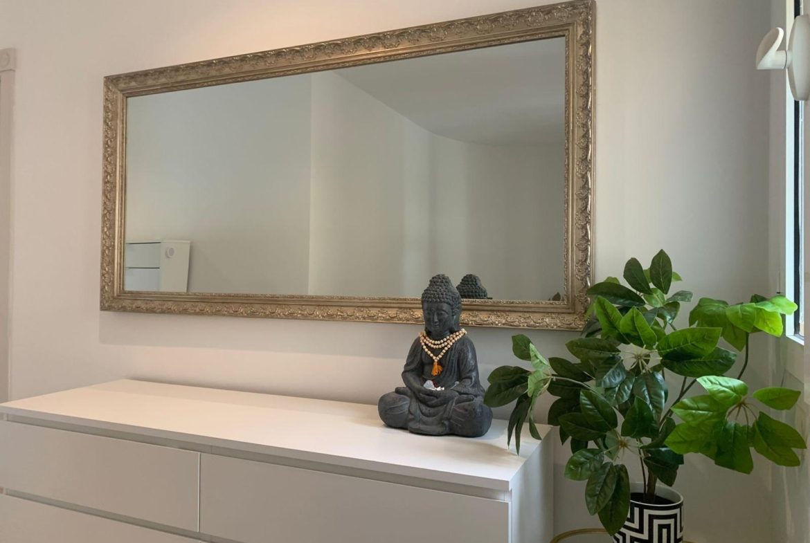 Bedroom interior with mirror and furniture in a duplex apartment in San Roque Club Sotogrande.