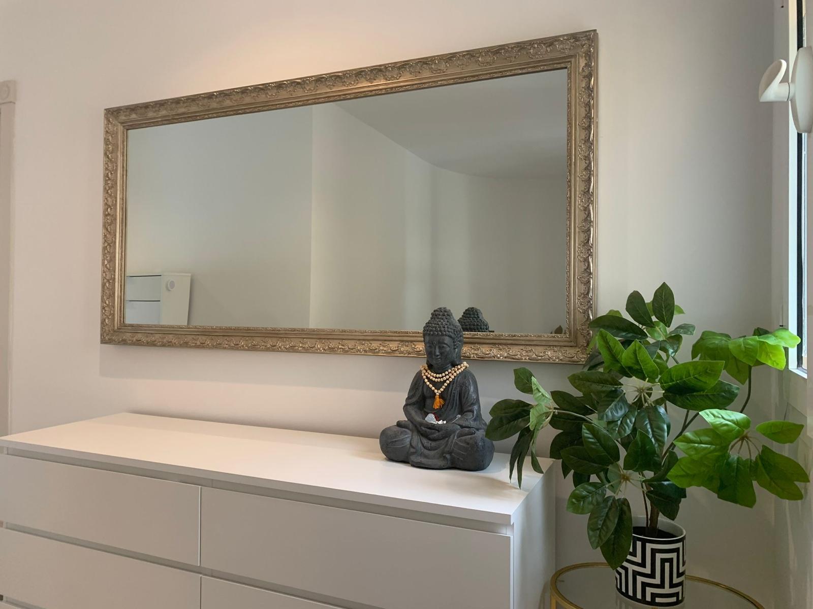 Bedroom interior with mirror and furniture in a duplex apartment in San Roque Club Sotogrande.
