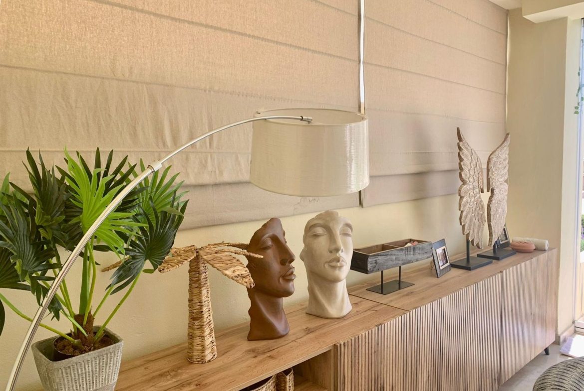 Decorative console table and interior décor inside a San Roque Club duplex apartment.