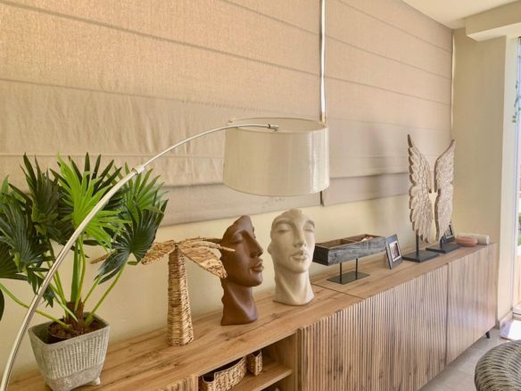 Decorative console table and interior décor inside a San Roque Club duplex apartment.