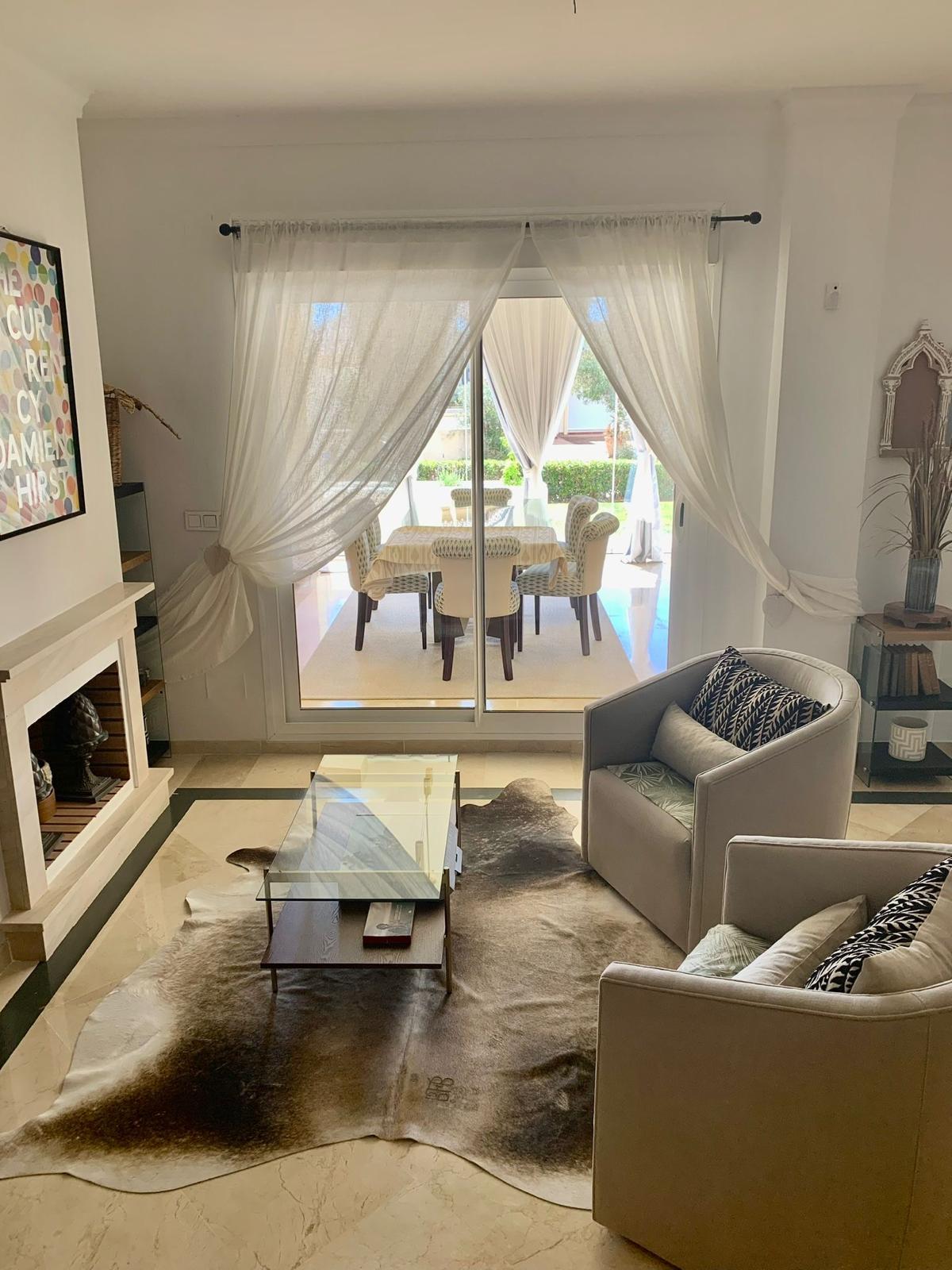 Spacious living room interior in a furnished duplex apartment in San Roque Club Sotogrande.