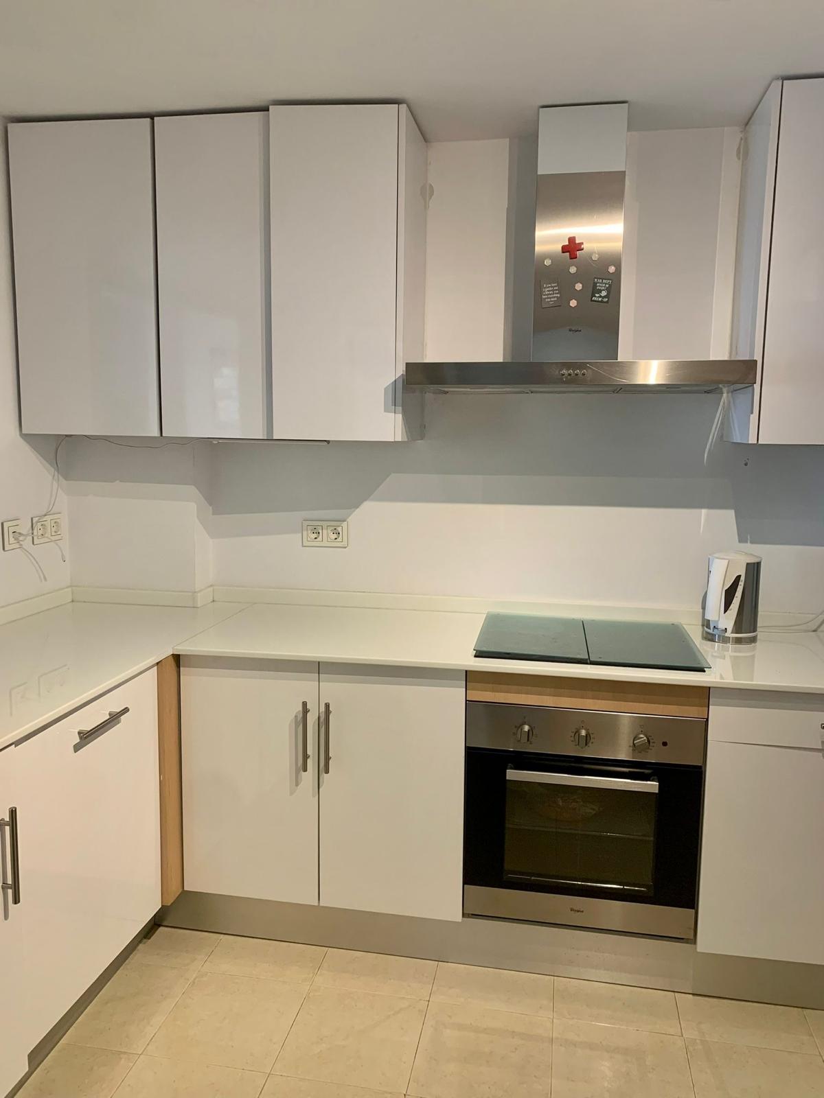 Modern kitchen with appliances in a duplex apartment in San Roque Club Sotogrande.