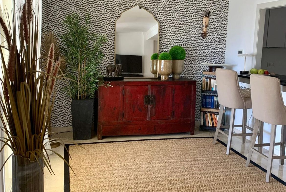 Open plan living and dining room inside a duplex apartment in San Roque Club Sotogrande.