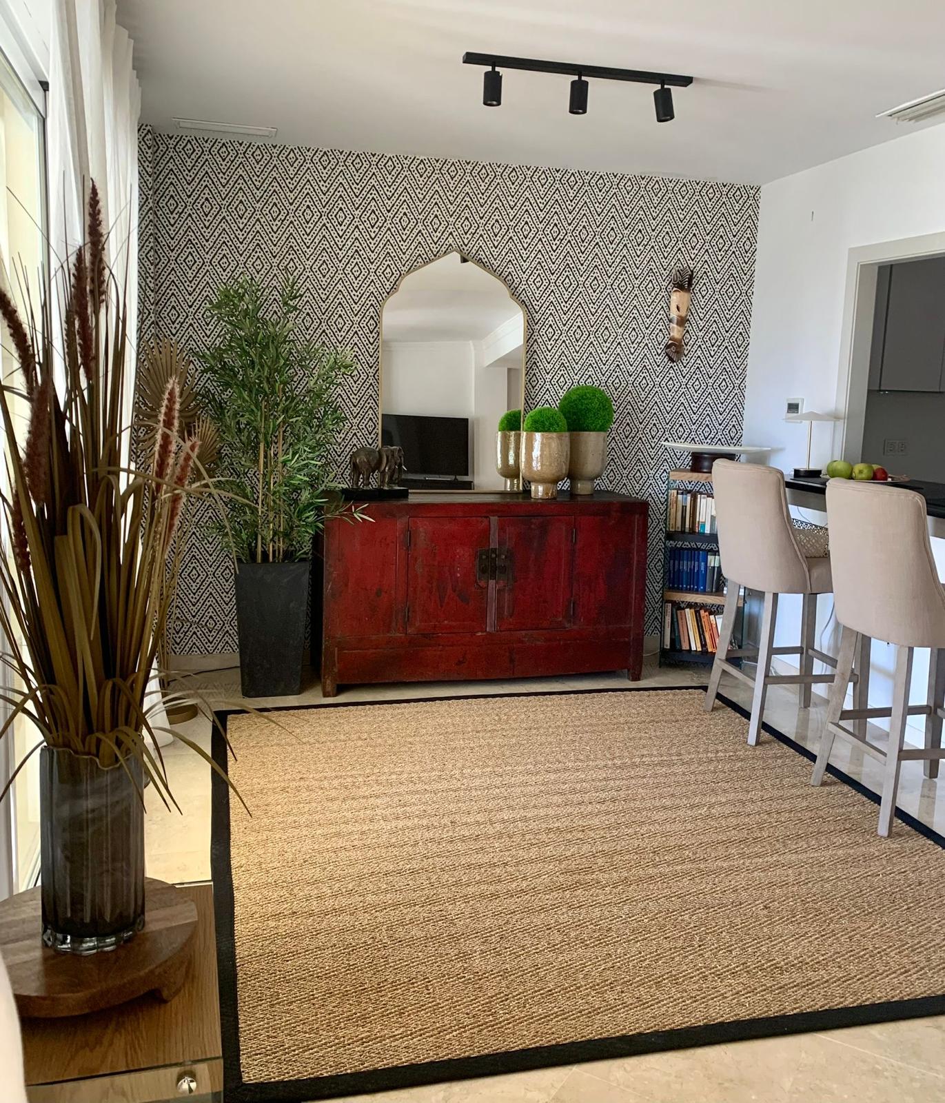 Open plan living and dining room inside a duplex apartment in San Roque Club Sotogrande.